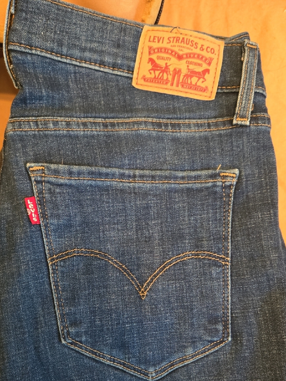 Levi's Women's Dark Blue Straight Leg Jeans with Tan Stitching